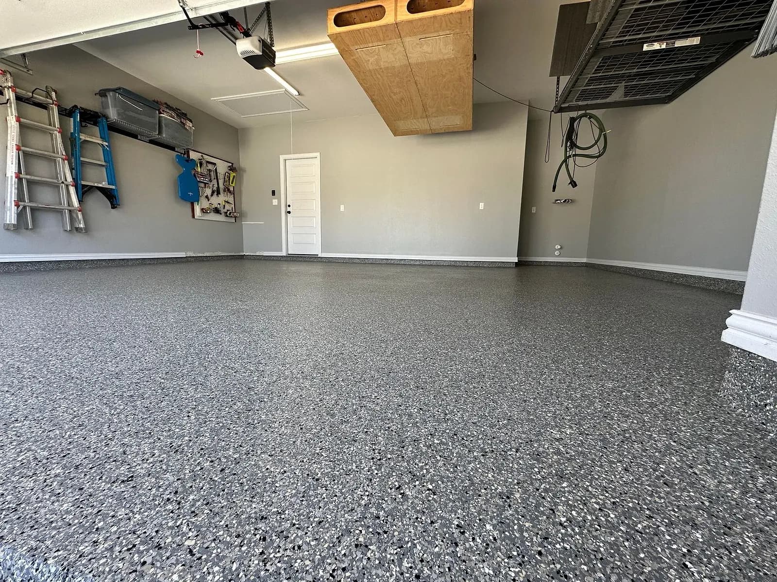 The same garage after a Heritage grey flake floor coating