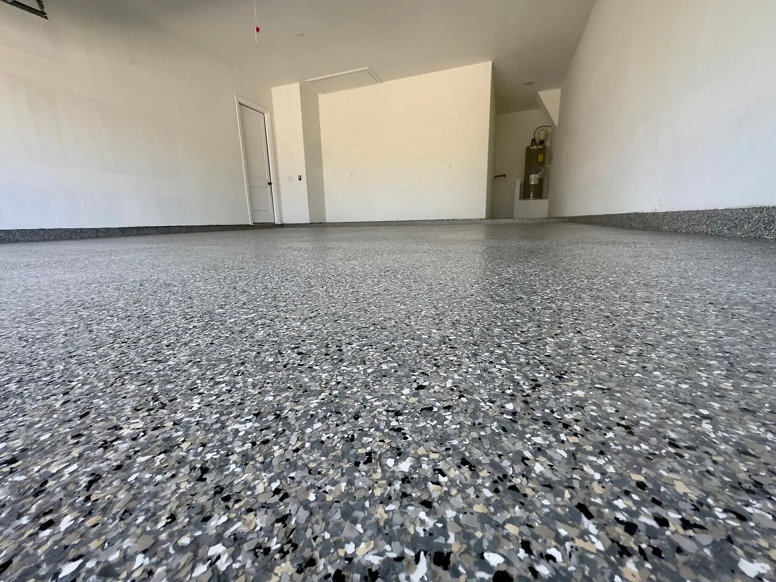 Floor-level close-up of a flake garage floor