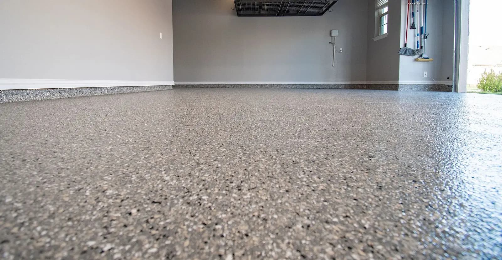 Gloss and flake texture of a coated garage floor, seen from floor level