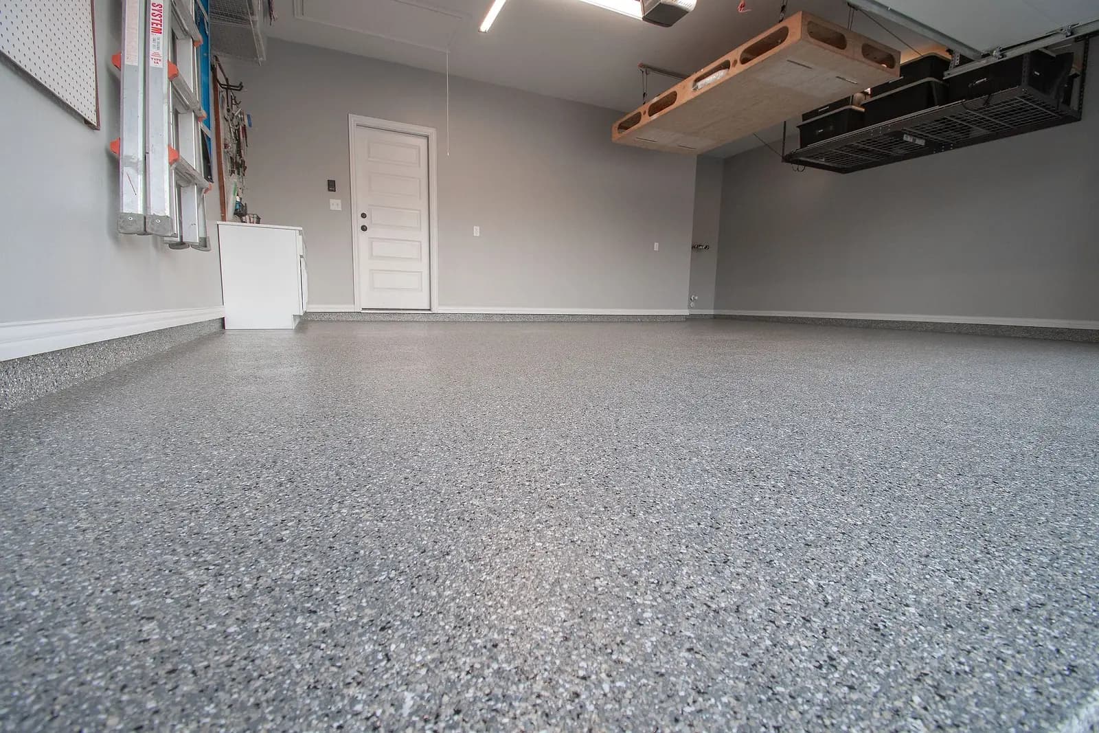 Floor-level view across a glossy flake garage floor