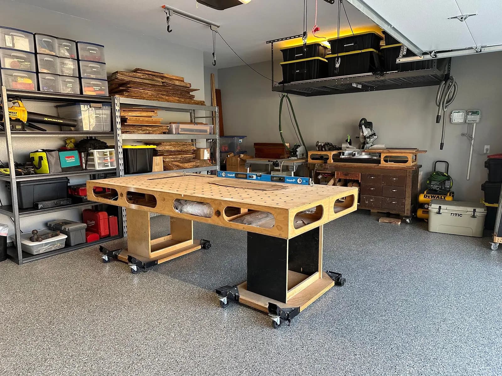 Home workshop with a rolling workbench on a coated flake floor